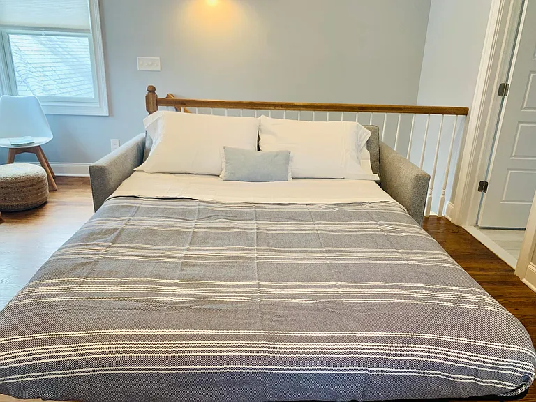 Living room couch opens to queen pull out