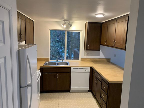 Kitchen with new sink and fairly new appliances.