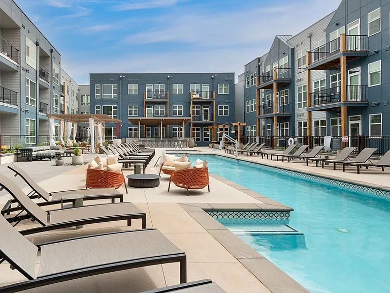 Pool and sundeck with lounge seating