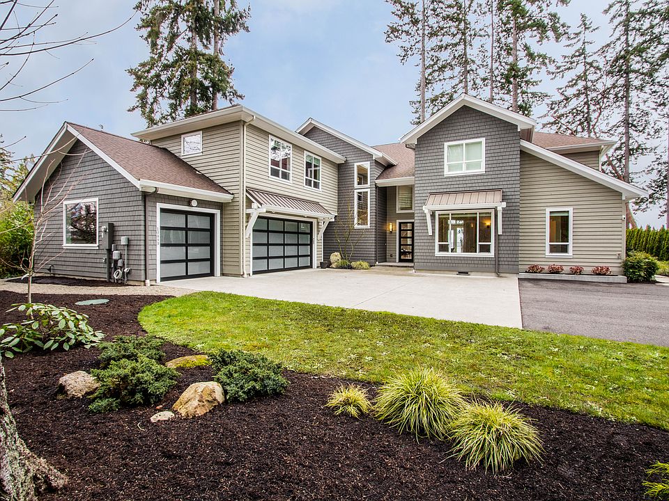 Down a private lane, sitting high on a bank looking over the Puget Sound sits your home in waiting.