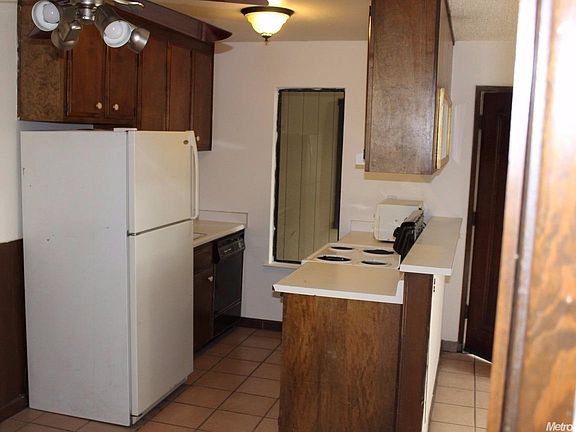 Kitchen includes refrigerator.