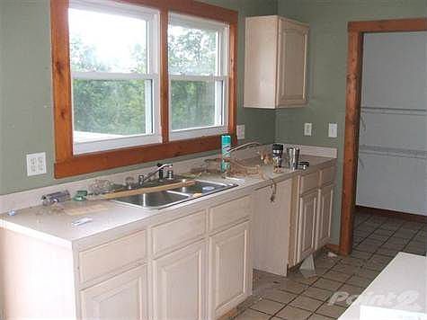 kitchen with natural lighting and nice view while you work and walk out to large rear deck for entertaining