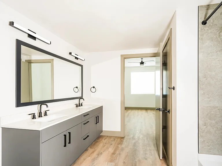 A spacious primary bath with dual vanities, clean finishes, and room to start and end your day with ease.