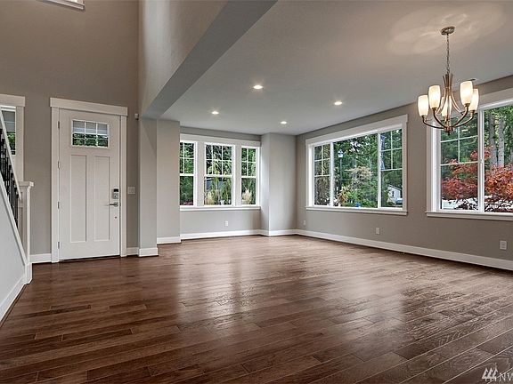 Entry opening to Living Room and Dining Room.  Photo not of actual home and may include options.