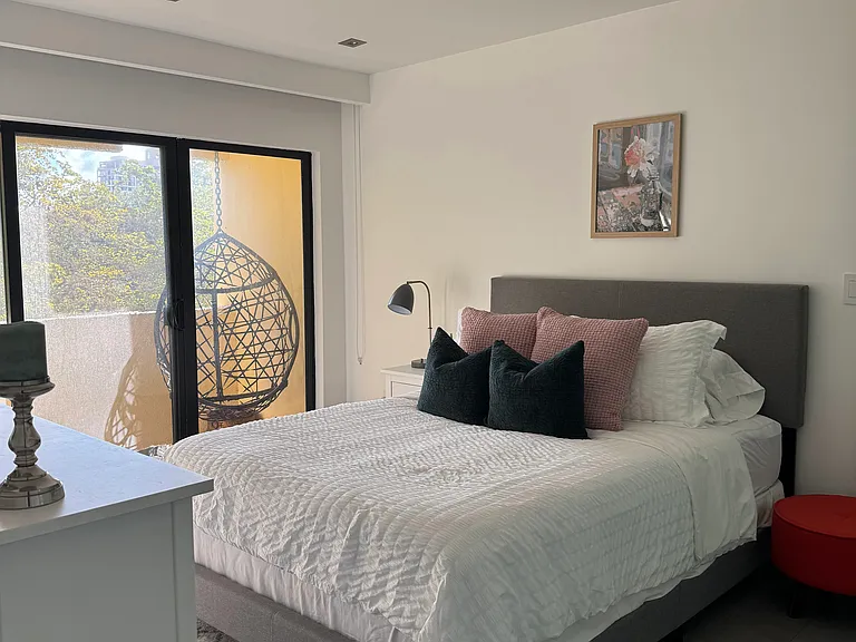 Master bedroom with balcony and on-suite bathroom