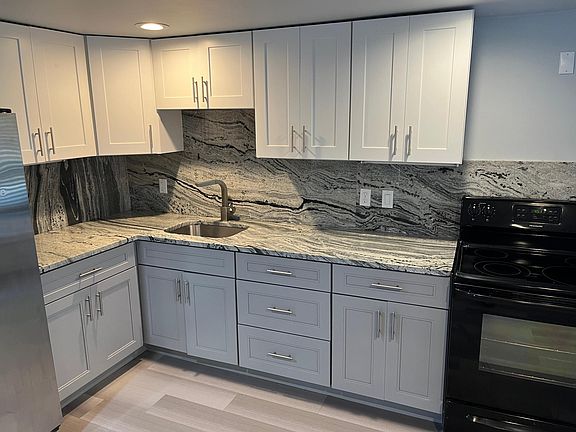 brand new kitchen with granite counter tops