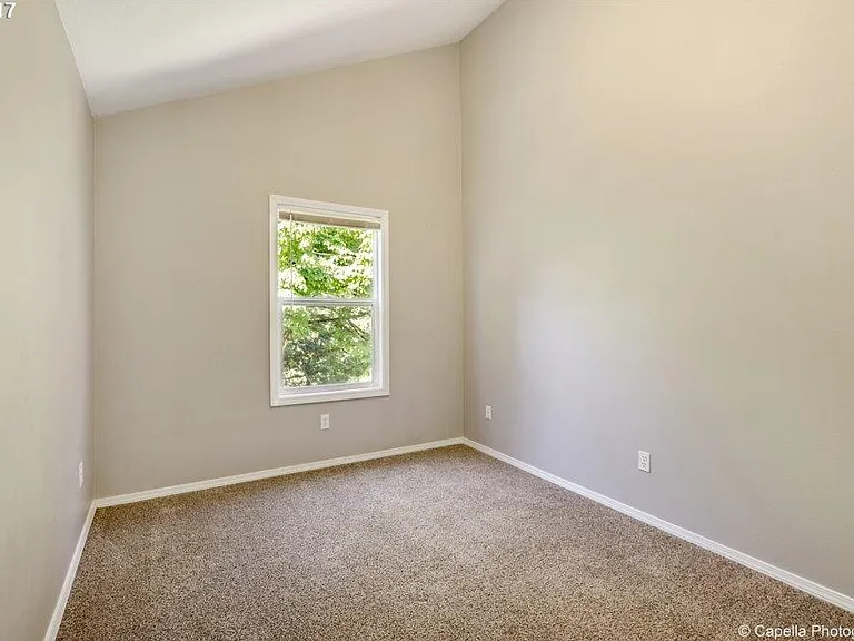 Third bedroom with tall vaulted ceilings.