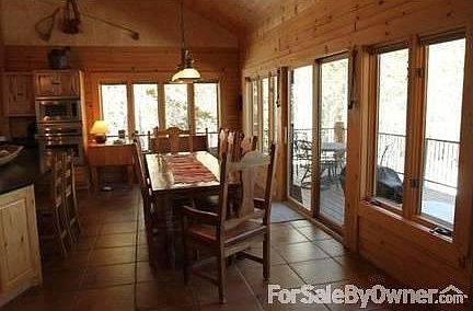 Kitchen
						:
						The kitchen features a large island with gas stove and soapstone top.