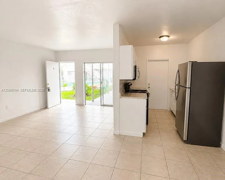 1951 NE 167th St #5 — Photo 1