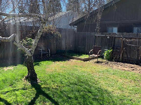 Back yard with raised bed for garden.
