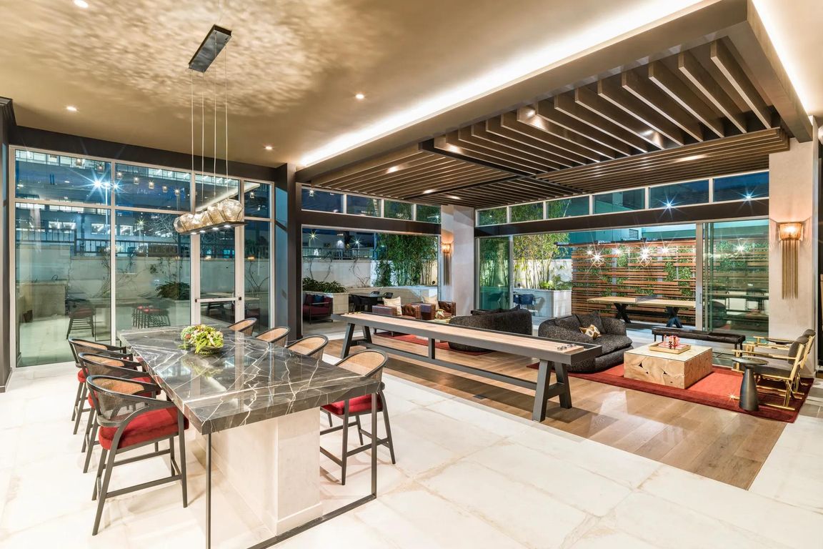 Sophisticated lounge spaces at Modera Argyle feature stylish seating, shuffleboard, and inviting areas to relax, entertain, or connect with neighbors.