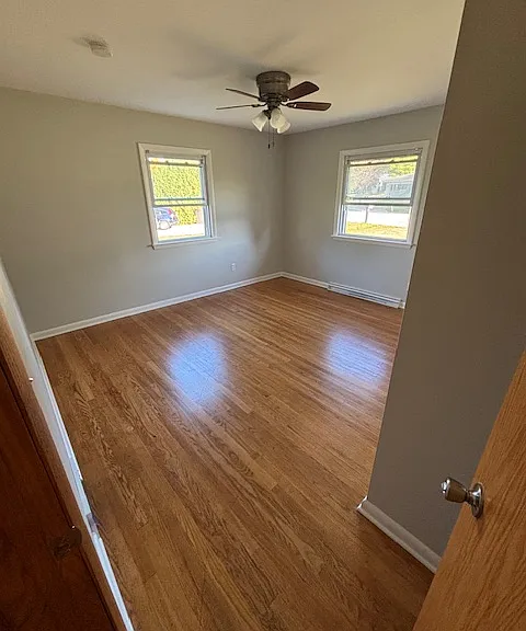Bedroom 2 with freshly varnished hardwood floor