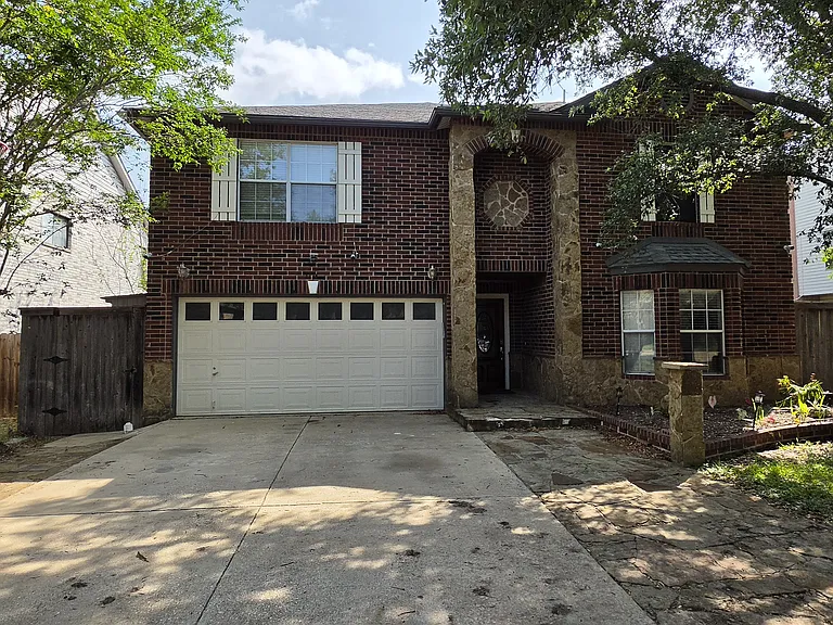 Front entry: Kids can play Basketball in the driveway.