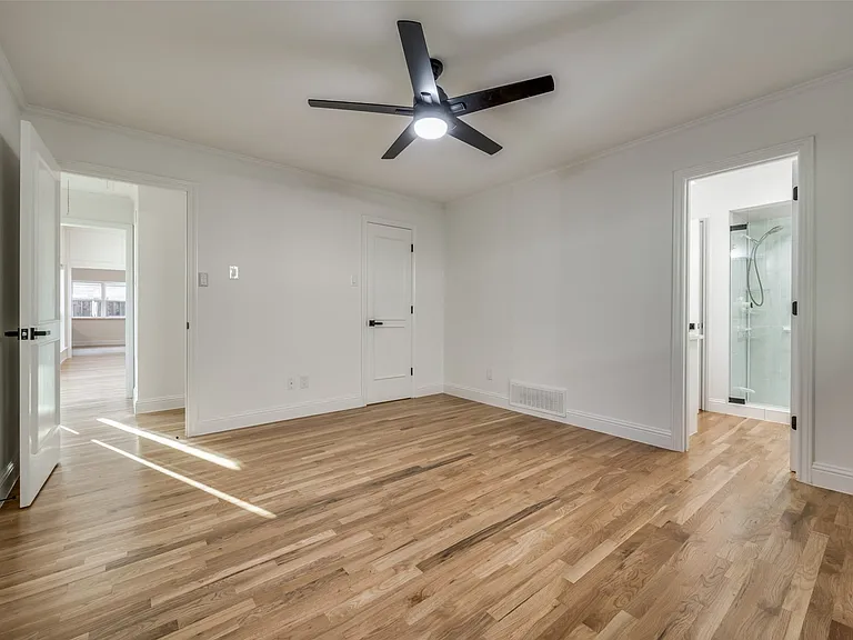 Secondary (middle) bedroom, with family to left rear of photo