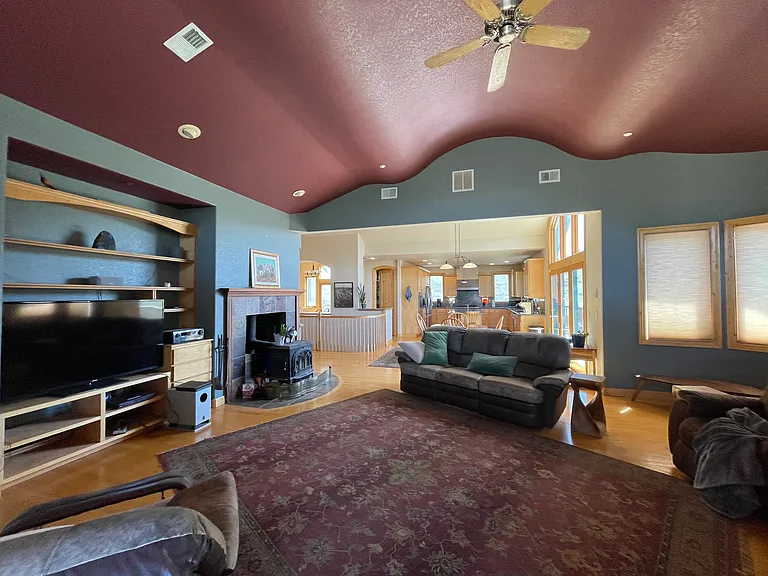 View from living room to kitchen. Cozy and warm colors wrap you up in comfort and style.