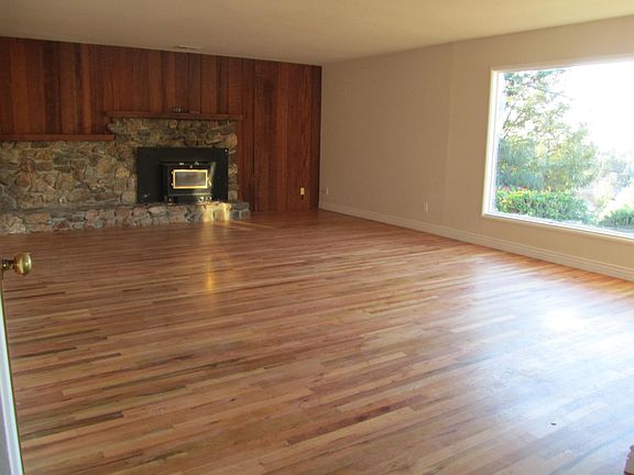 Living/Family room; hardwood floors, picture window, wood bu