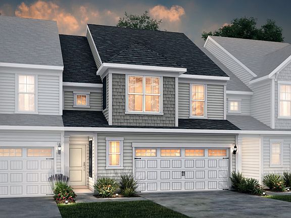 Palomino Exterior 5 features siding, shakes, covered front door and 2-car front load garage