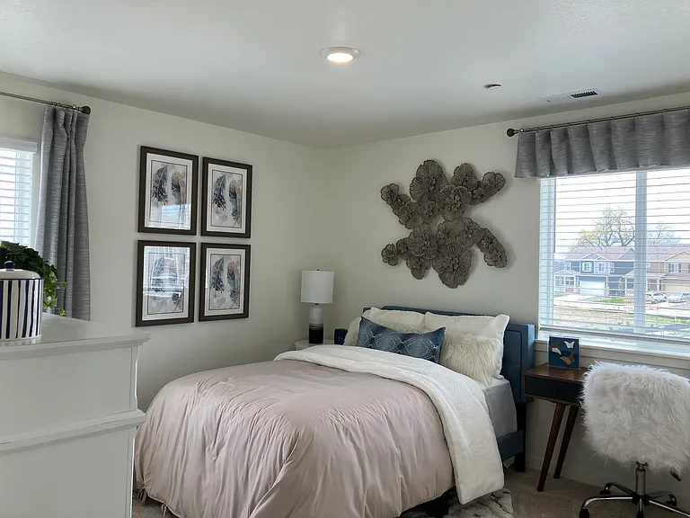 Sample of same floor plan, different finishes, staged with furniture.