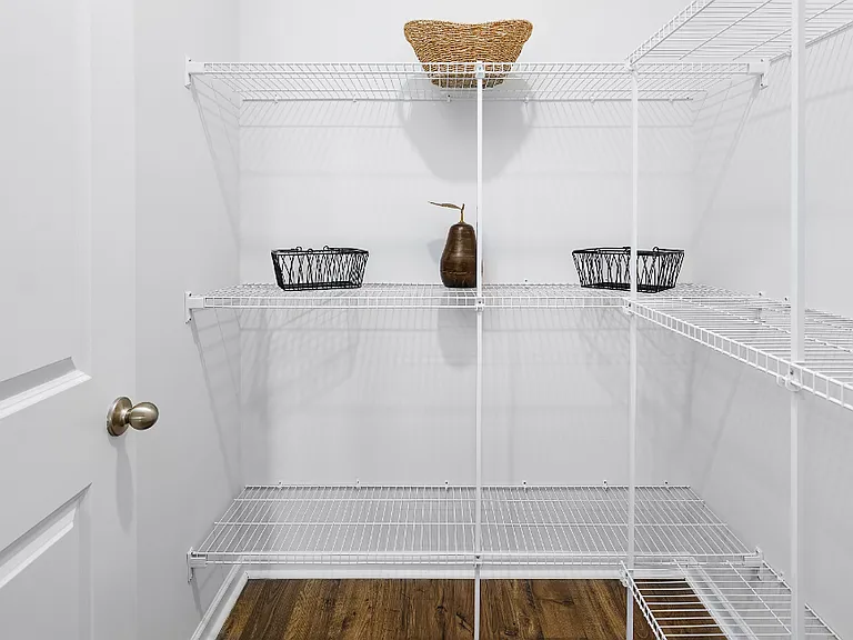 Primary Closet. Photos are builder provided and do not reflect current furnishings or finishes.