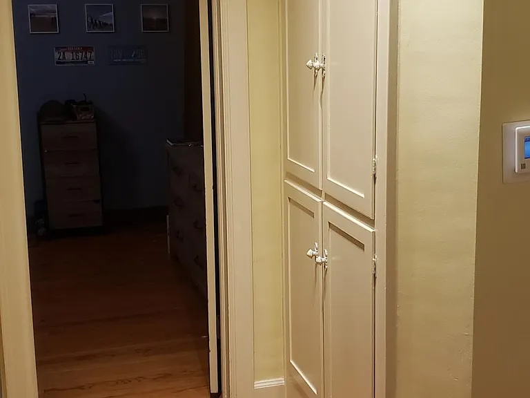 Hallway with storage cabinets
