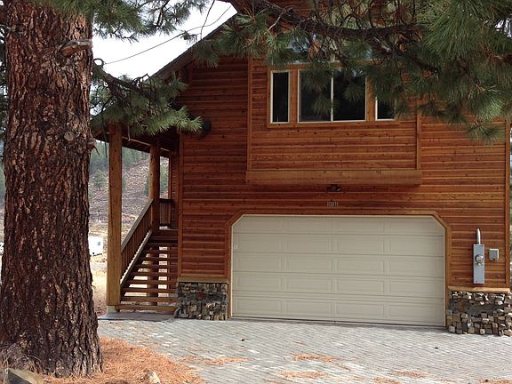 Front view of house from the large 4-car driveway.