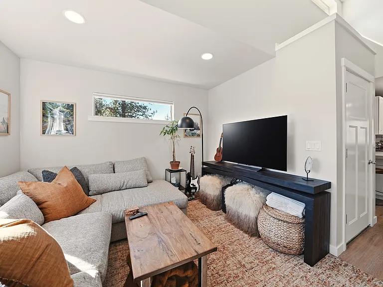 Brand new LG Smart TV is crystal clear. Lots of extra poufs and blankets for your comfort. This City Home couch is down-filled and sumptuous!