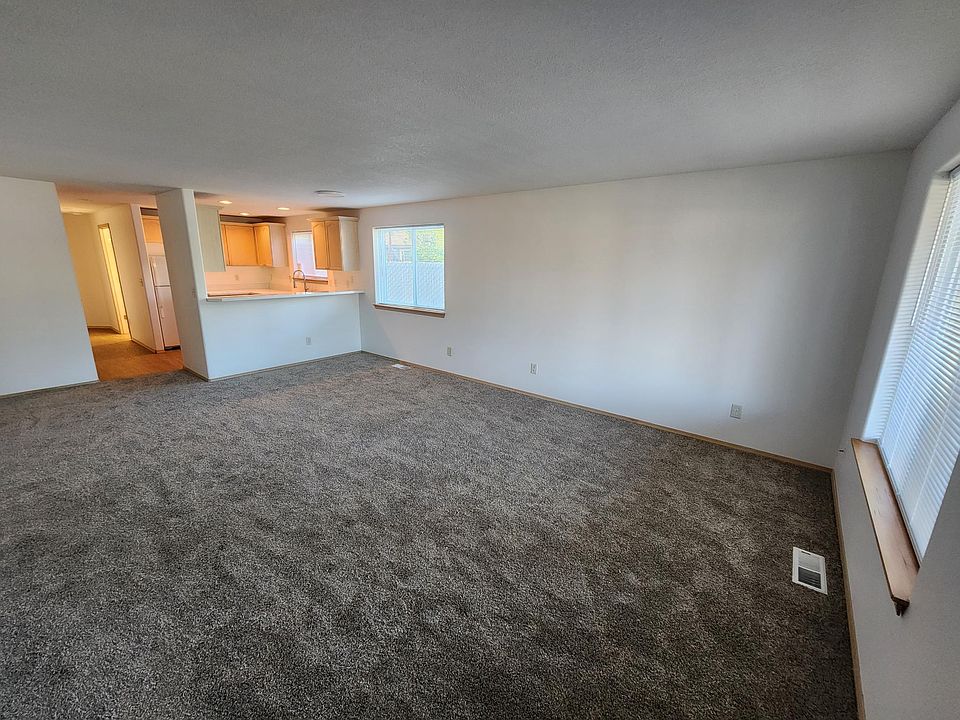 Living room, as seen when walking in the front door. New carpet