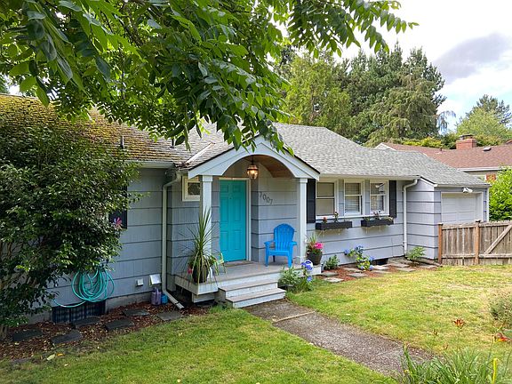 Fenced-in front yard with mature landscaping