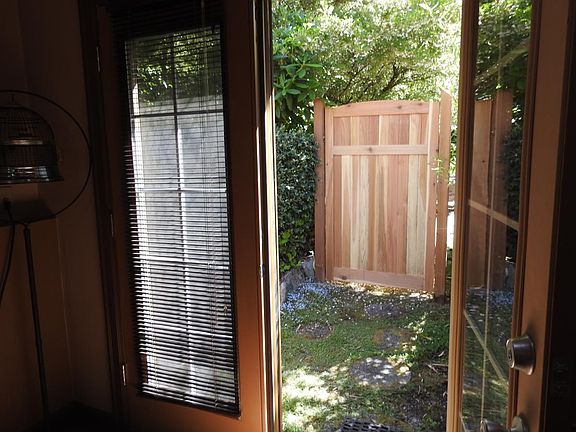 East private patio by garden, larger patiuo to the left