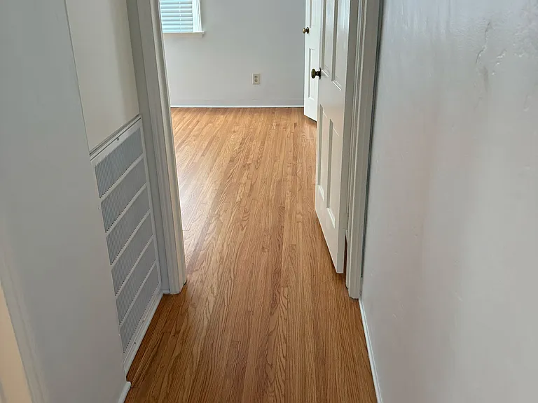 Hallway looking into main back bedroom