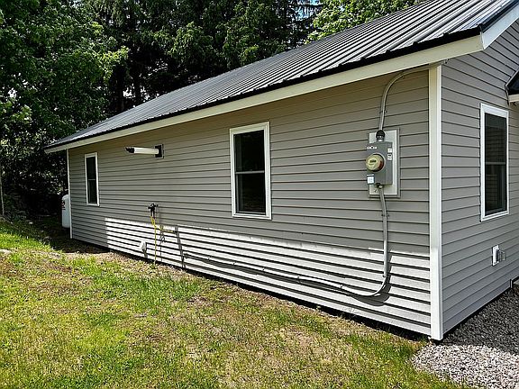 Left side of the house.