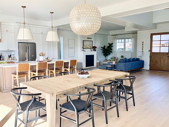 Dining room table fits 8-10 easily and bar at kitchen island has space for 4. The dining room is open to the rest of the house and there are 12' panoramic folding doors for an epic indoor/outdoor lifestly