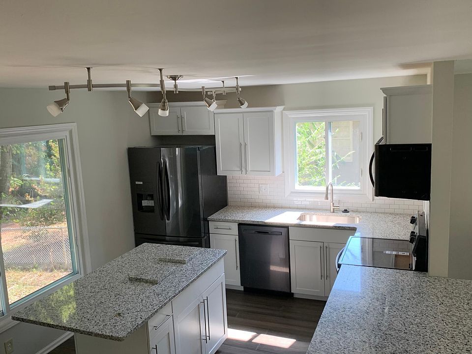 Kitchen with two bar areas.