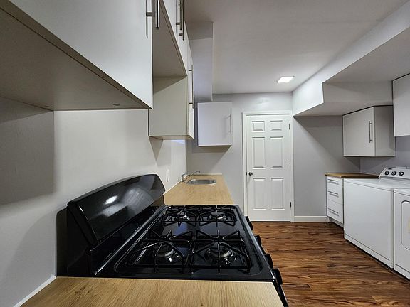 Kitchen leads to Storage Room 2