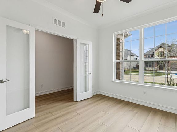 Airy study with large windows real home pictured