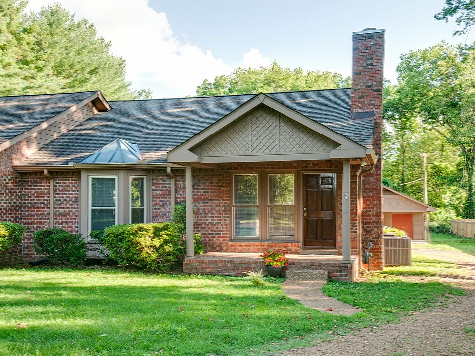 Home has large covered front porch.
