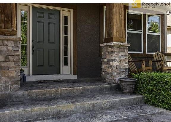 Relaxing front porch, stacked stone pillars