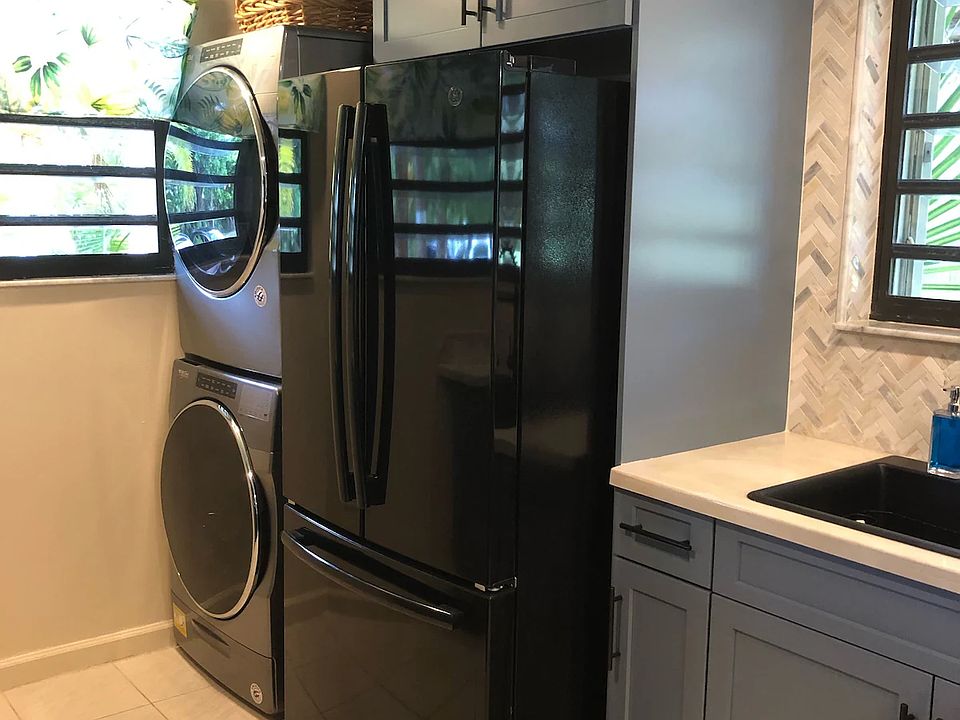 Kitchen with full size fridge, washer and dryer