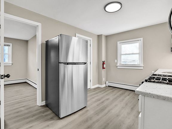 Kitchen View with bedroom 1 view on left (1st Floor)