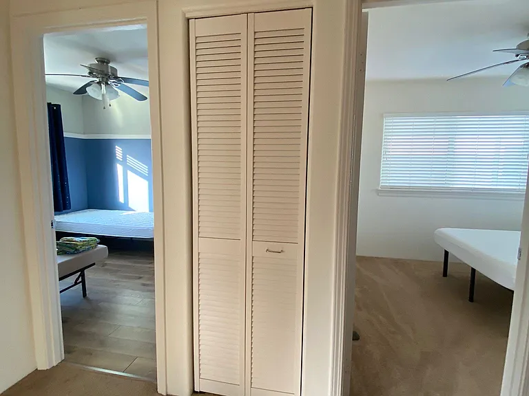 Hallway closet between 2 guest bedrooms