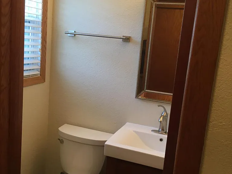 1/2 Bath (upstairs off Laundry Room/Rear Entry)