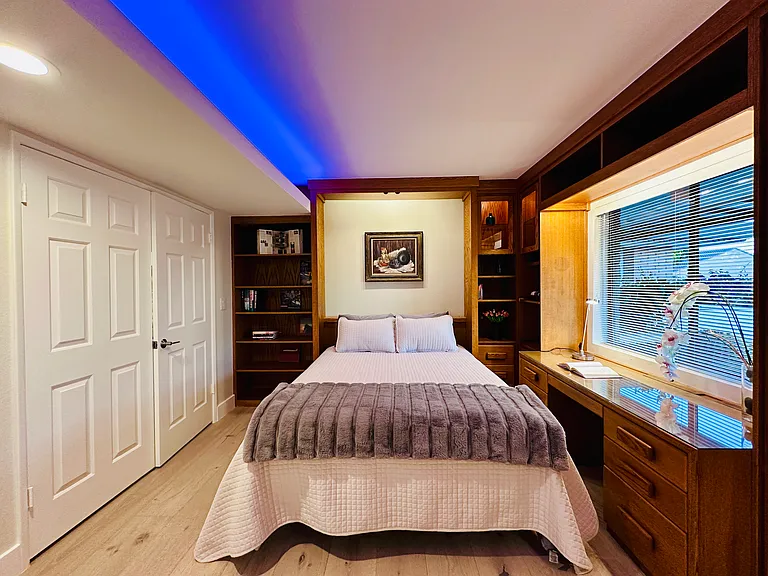 Guest bedroom/ Office with a murphy bed (Queen size), customed desk, shelves and cabinets...