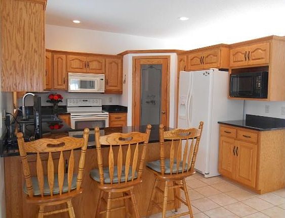 Another view of the kitchen with nice size pantry.