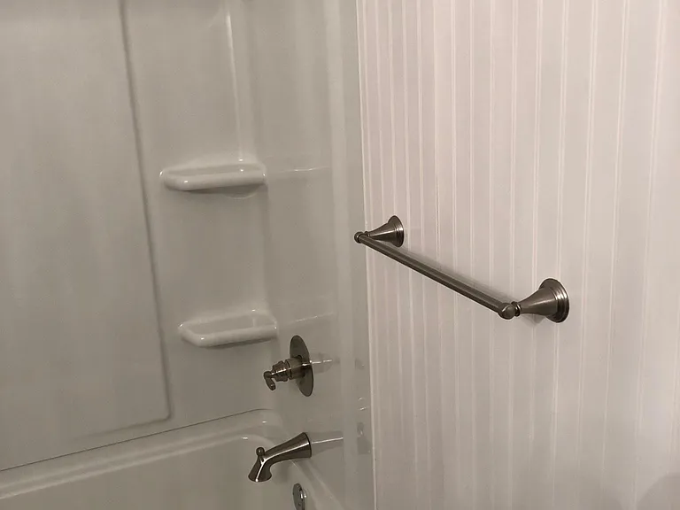New renovation is hall bathroom. New shower/tub with Delta fixtures.