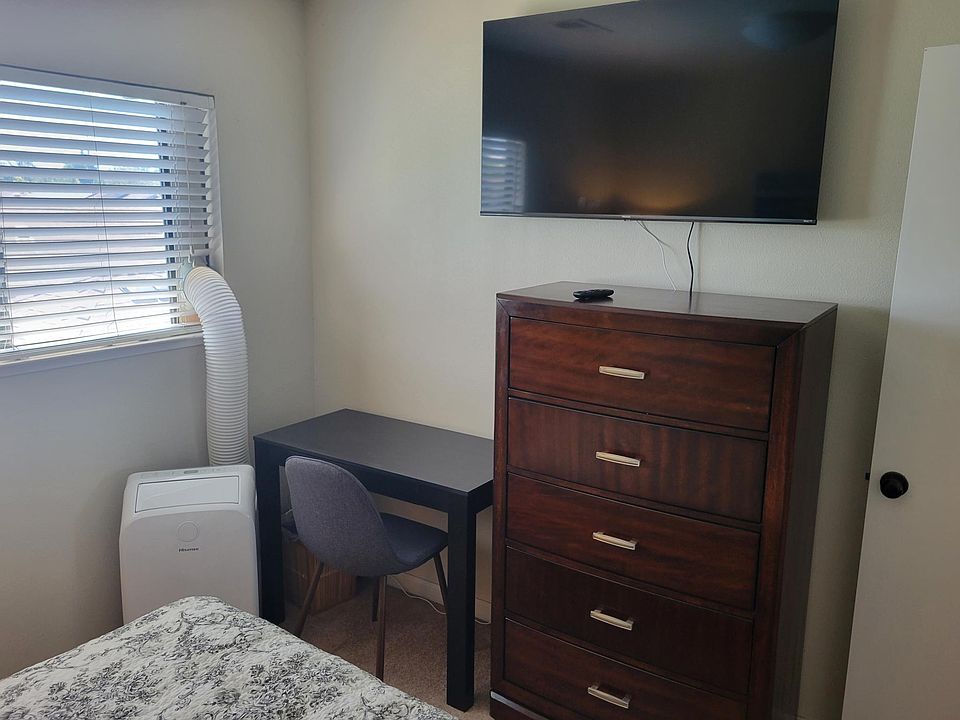 Bedroom 1 - TV dresser, desk, AC
