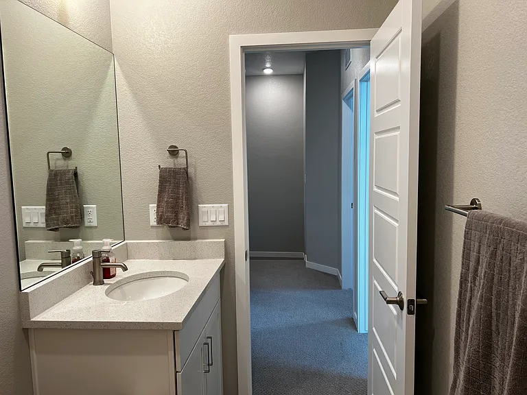 Sink and hallway for 2 bedrooms