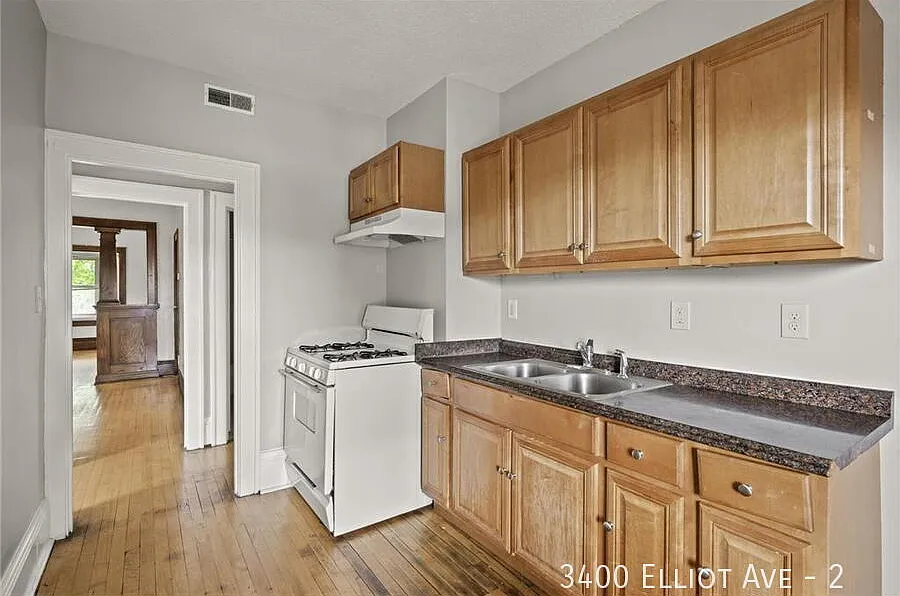 Charming 1-Bedroom Haven with Gleaming Hardwood Floors at 3400 Elliot Ave! — Photo 1