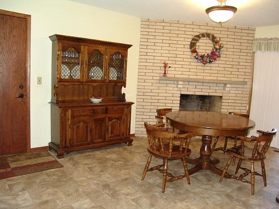 Dining room with fireplace and sliding glass door that walks out to deck