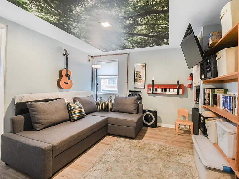 Basement guest room from entry door at bottom of stairs