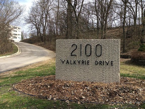 Private Drive to Building surrounded by wooded area